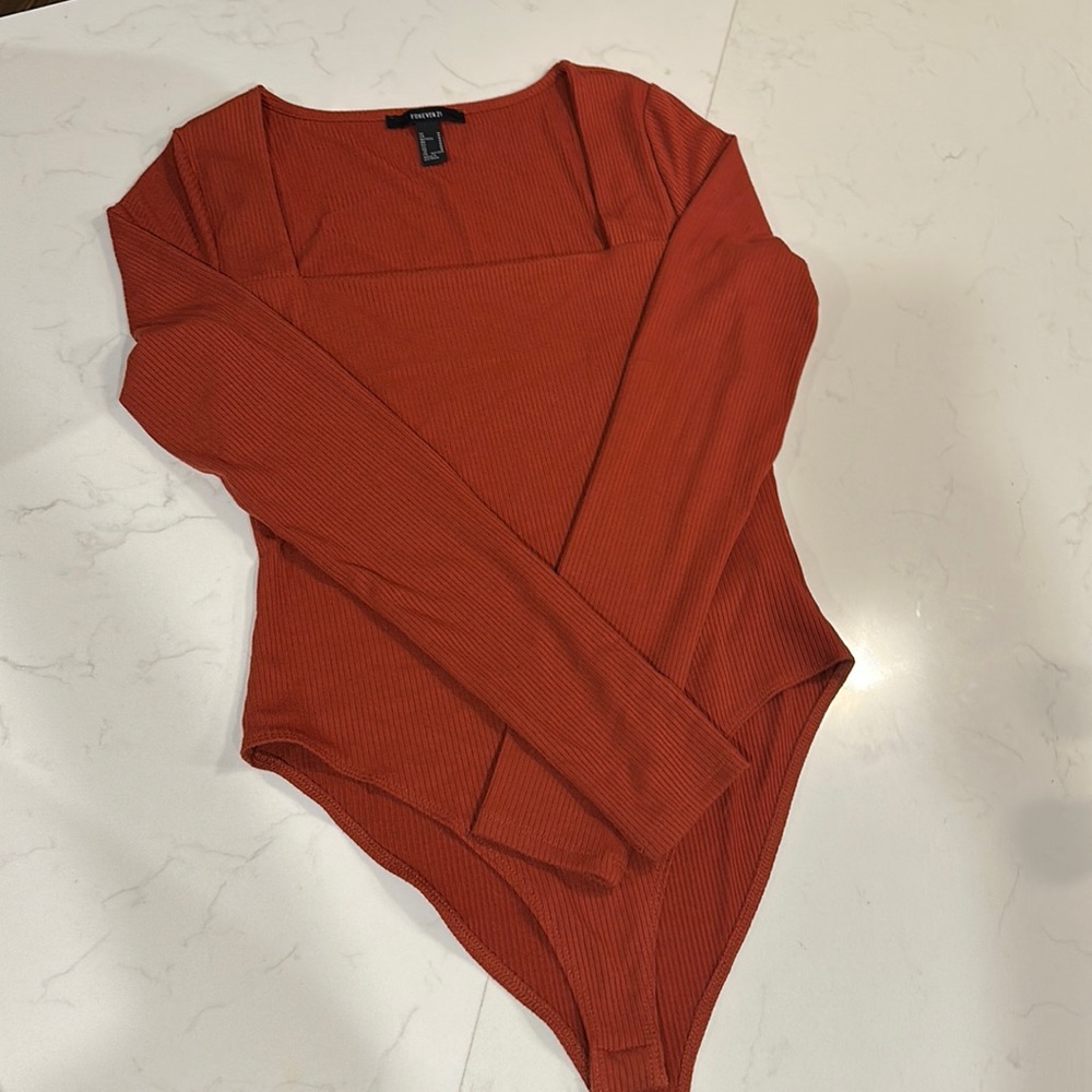 Burnt orange long-sleeve bodysuit